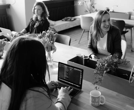 group of woman on laptops