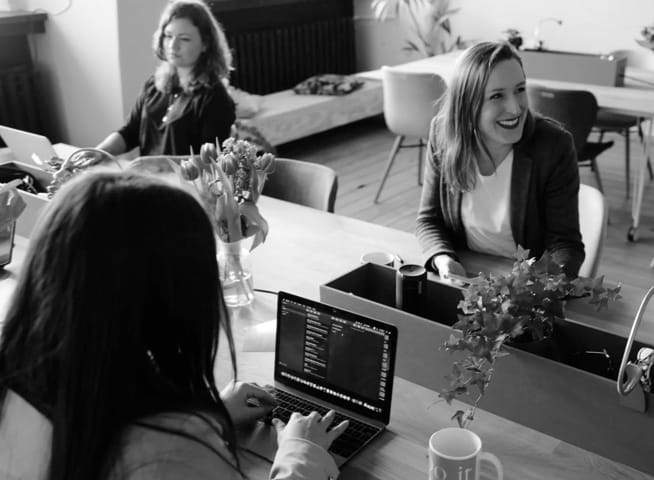 group of woman on laptops